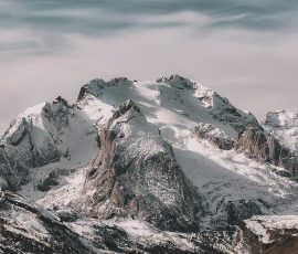Snow-covered mountain range under cloudy sky snowy peaks foogallery sample image 3
